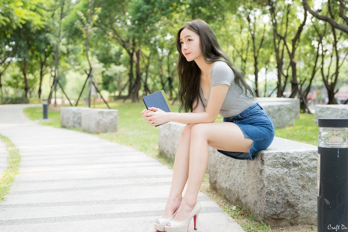 4K Asian Brunette Girl Sitting Outdoors