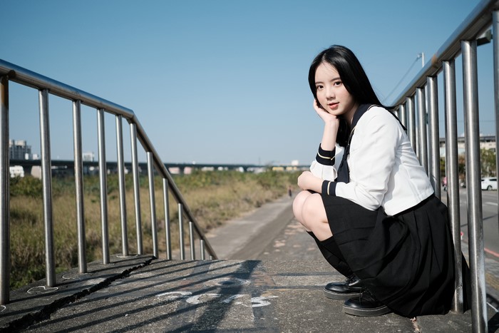 4K Asian Brunette Girl Sitting in Uniform