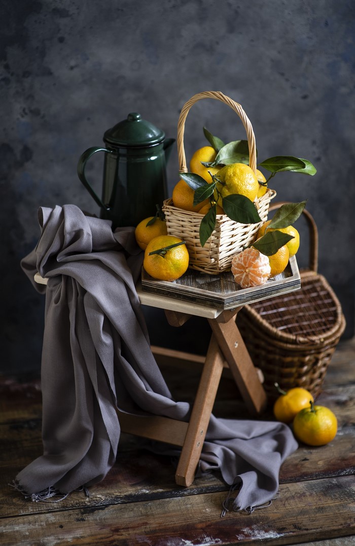 Still life with mandarins and a green kettle