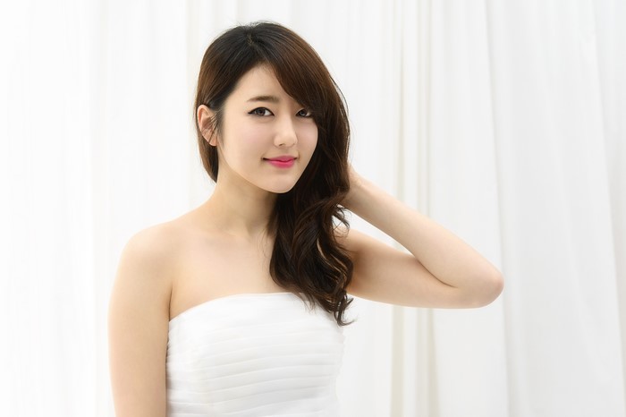 4K Portrait of Smiling Asian Woman with Brown Hair