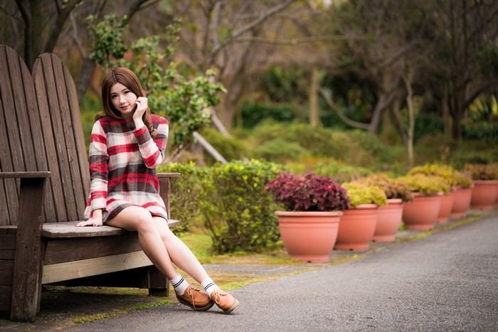 4K Asian Woman Sitting on Wooden Bench