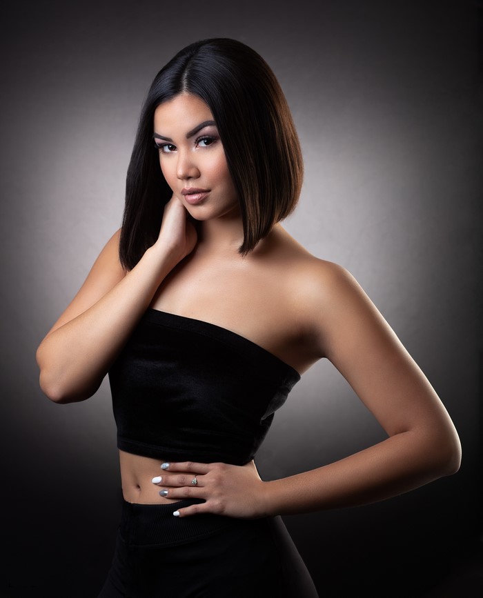 Woman in black tube top posing