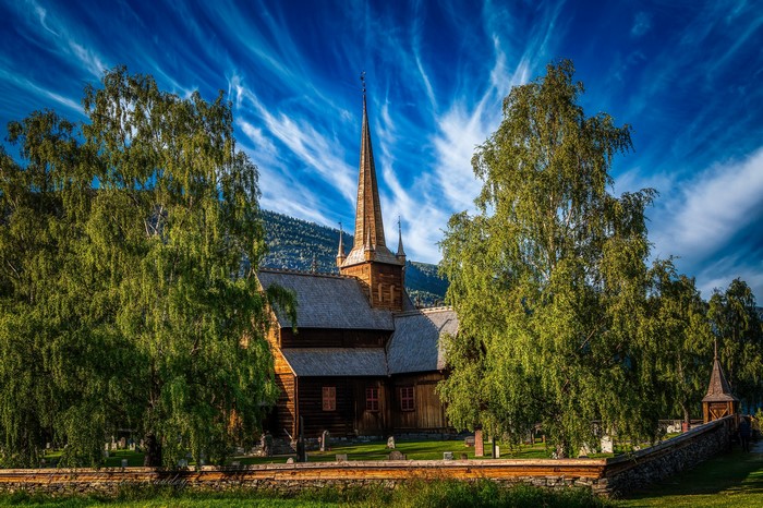 4K Lom Church in Norway with Trees