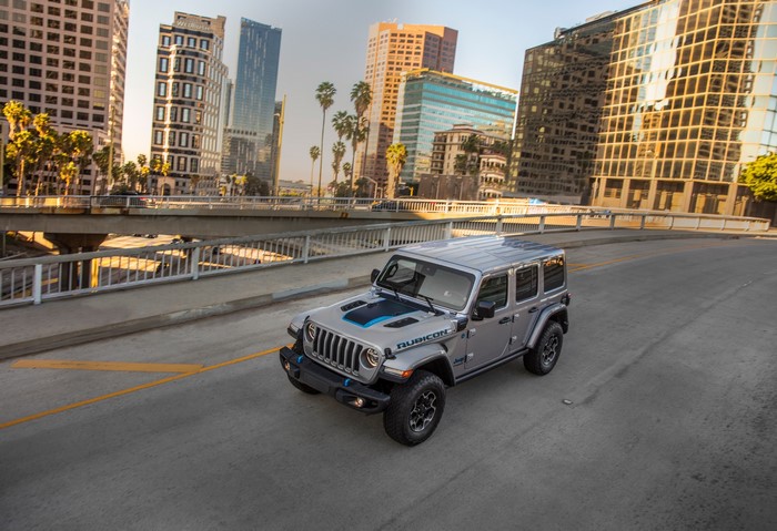 Grey Jeep Wrangler Unlimited Rubicon 4xe on city street