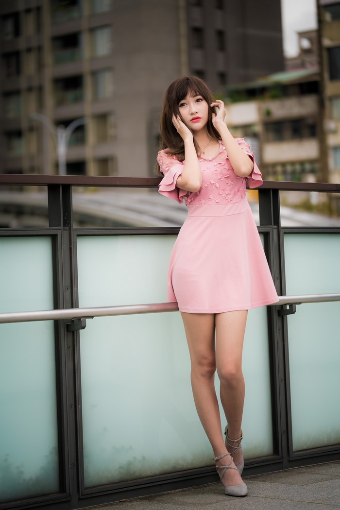 Asian Woman in Pink Dress Posing Outdoors