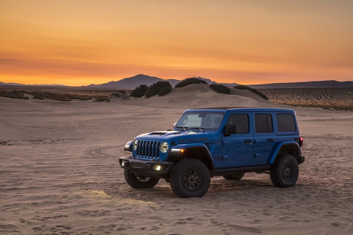 Blue Jeep Wrangler Unlimited Rubicon 392 in desert at sunset