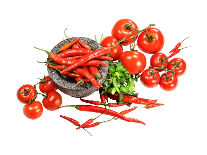 Tomatoes and Chili Peppers with Mortar and Pestle