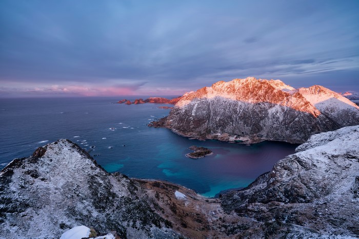 Snow-covered mountains and coast in Lofoten, Norway