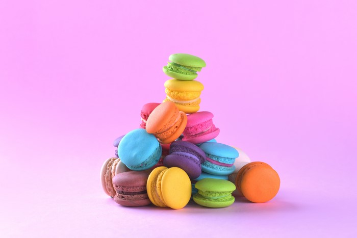Multicolor macarons on a pink background
