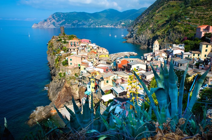 Vernazza, Italy: Colorful houses on a rocky crag overlooking the bay