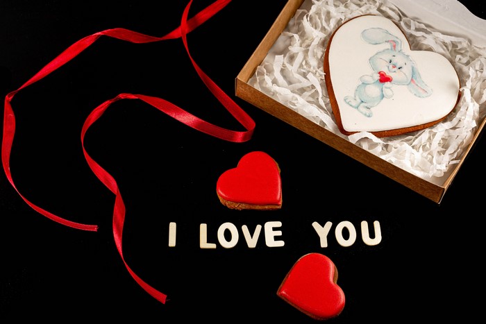 Valentine's Day heart cookies with ribbon and text