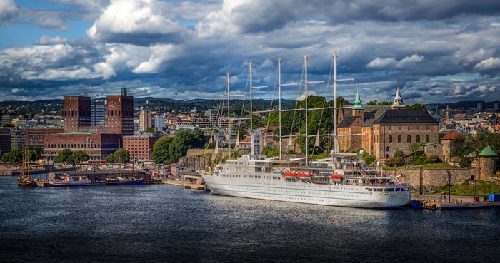 Oslo City Hall and Akershus Fortress with a large ship