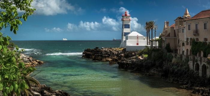 Lighthouse and houses on the coast of Cascais, Portugal