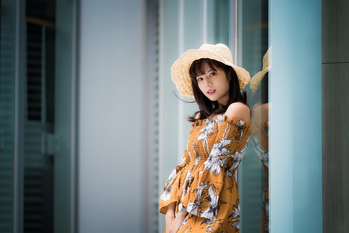 Asian girl with hat and floral dress