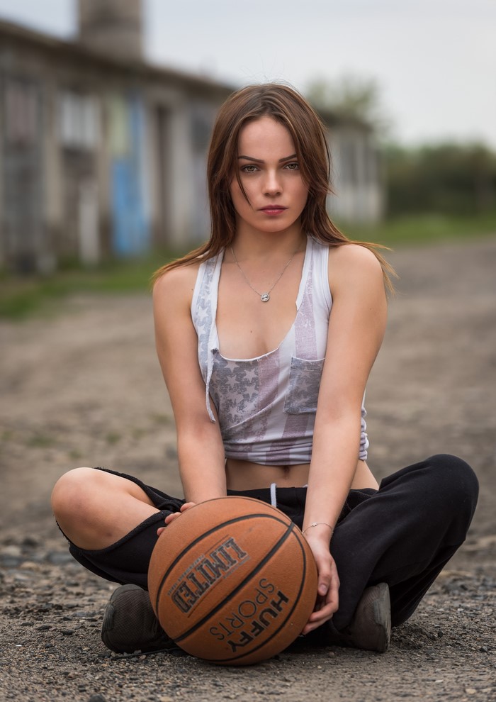 Klaudia Latto sitting with a basketball
