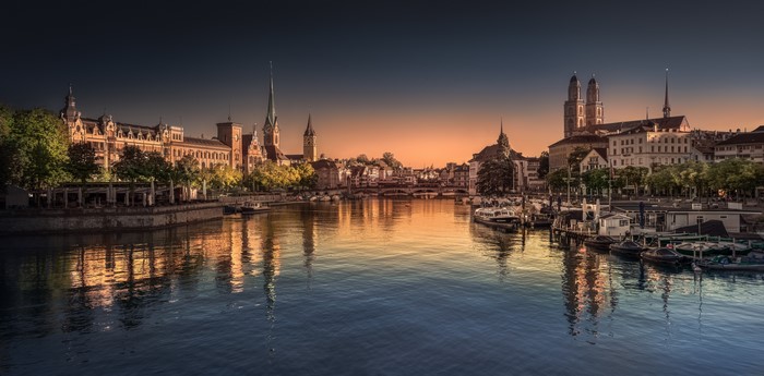 Zurich panorama with river and historic buildings at sunrise