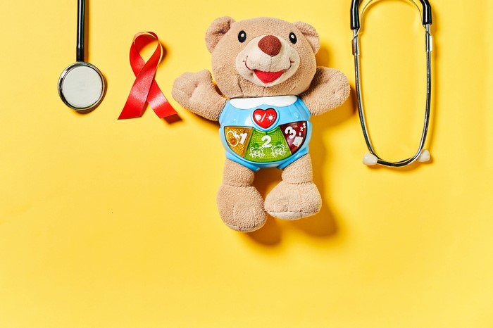 Teddy bear with stethoscope and red ribbon