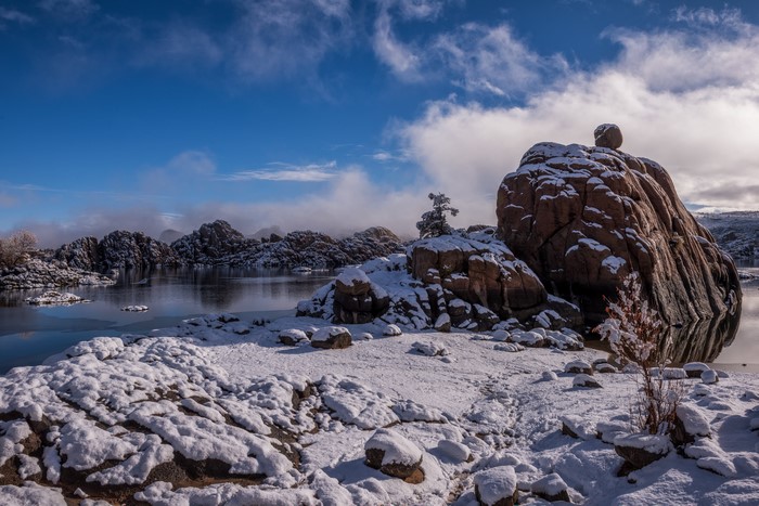 Winter landscape with snow-covered rocks and a lake in Prescott, USA