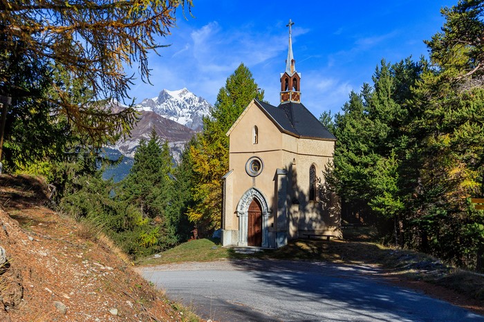 Chapel in Bramans, France, with Alps Mountains in the background
