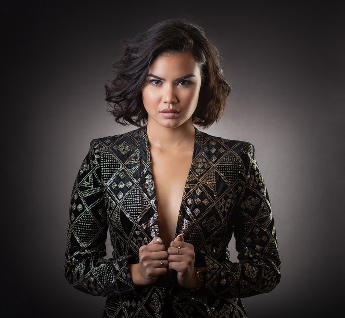 Elegant Woman in Patterned Suit Jacket