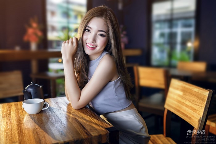 4K Asian Woman Sitting at Cafe Table