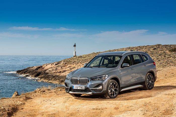 Grey BMW X1 xDrive25e xLine Crossover by the Sea