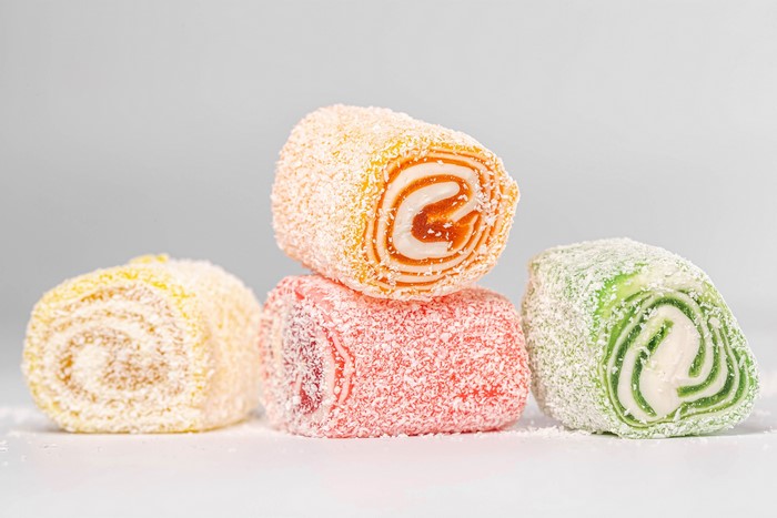Colorful Turkish Delight rolls covered in coconut