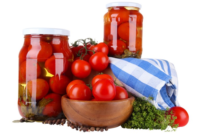Jars of Pickled Tomatoes with Fresh Tomatoes and Herbs