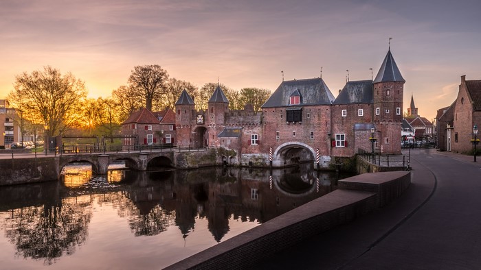 Koppelpoort gatehouse and bridge in Amersfoort, Netherlands at sunset