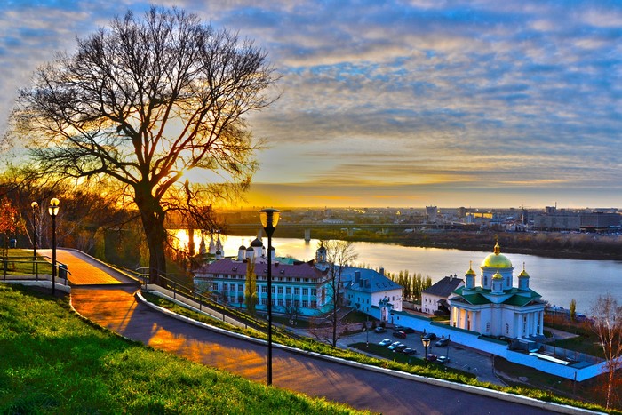 Nizhny Novgorod cityscape with river and church at sunset