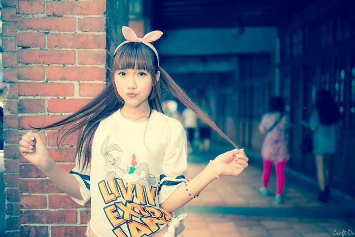 Asian girl with rabbit ears headband and Bugs Bunny shirt