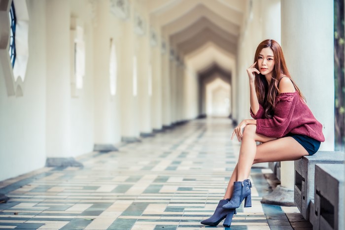 4K Asian Woman Sitting with Legs Crossed