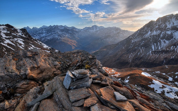 Rocky mountain landscape with snow and clouds