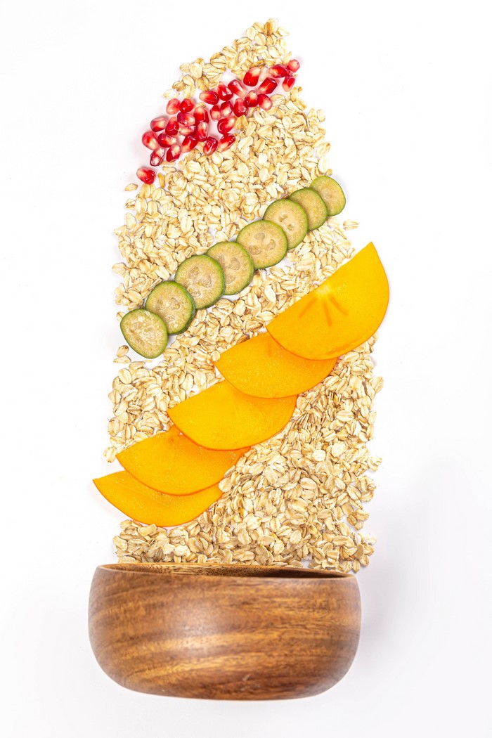 Oatmeal with Pomegranate, Feijoa, and Persimmon Slices