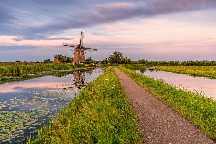 Windmill and canal in South Holland, Netherlands