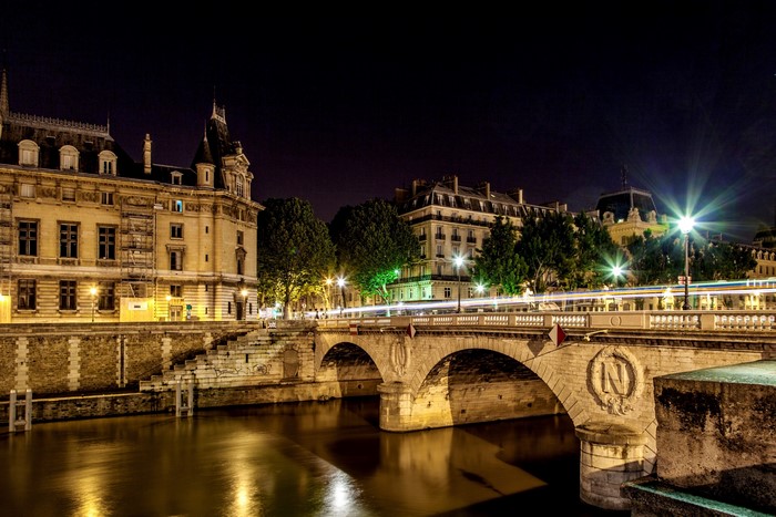Paris Bridge at Night with River and Buildings