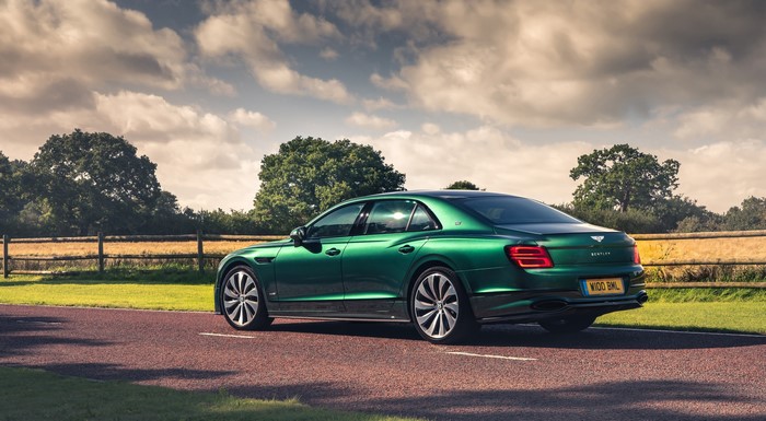Green Bentley Flying Spur Sedan on a Road
