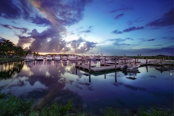Boats docked in a marina at sunset in Florida