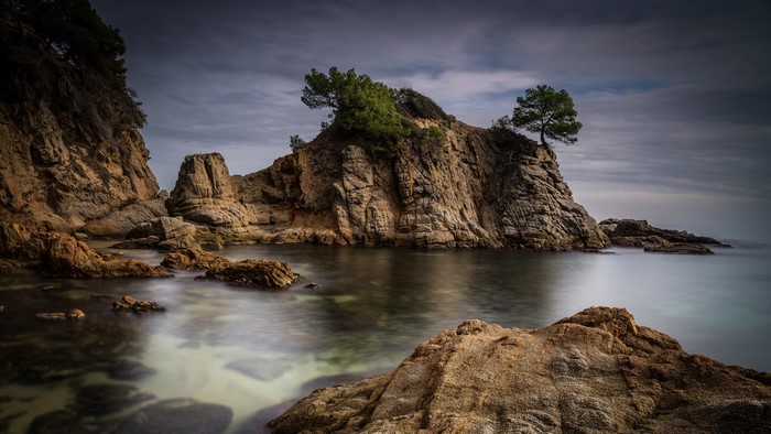 Costa Brava Coastline with Rocky Outcrops and Trees