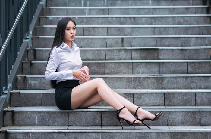 4K Asian Brunette Girl Sitting on Stairs
