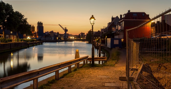 Evening canal in Maassluis, Netherlands with street lights