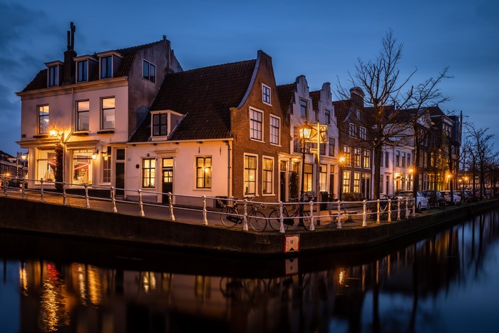 Houses along a canal in Haarlem, Netherlands at dusk
