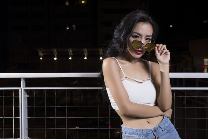 Brunette girl with sunglasses at night