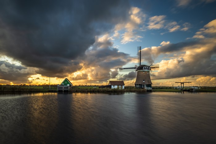 Windmill and canal in Krommeniedijk, Netherlands