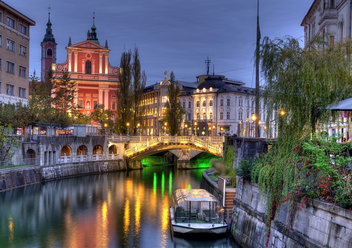 Ljubljanica River at Night with Bridge and Boat