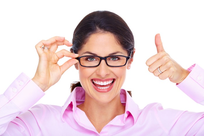 Woman with glasses giving a thumbs up
