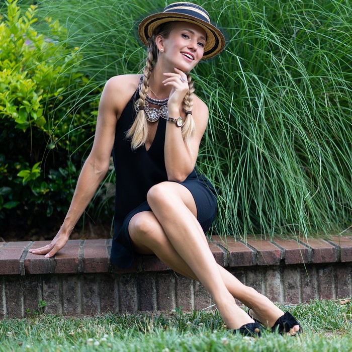 Olga Clevenger wearing a hat and dress