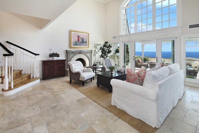 Living room with fireplace and ocean view