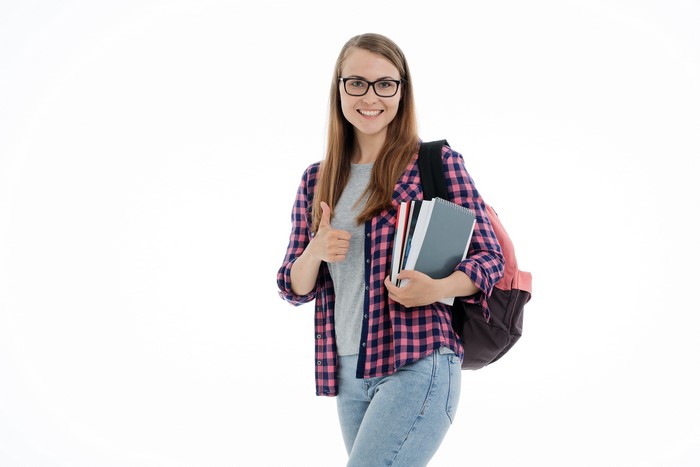 Female student with glasses and backpack holding books