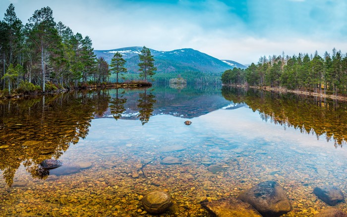 Lake with forest and mountains in Karelia, Russia